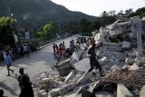 Suman mil 419 muertos por sismo en Haití

